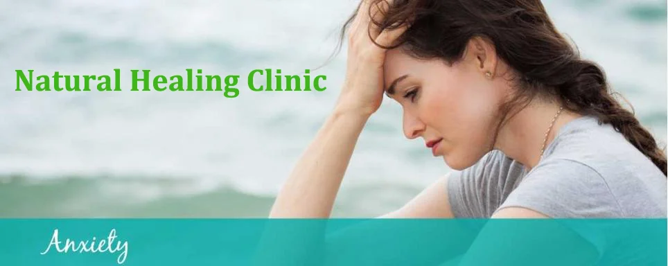 Woman sitting and experiencing anxiety, representing mental health support at Natural Healing Clinic