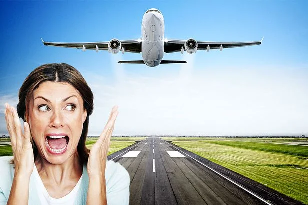 Person experiencing fear of flying, symbolizing therapy and support for flight anxiety at Natural Healing Clinic